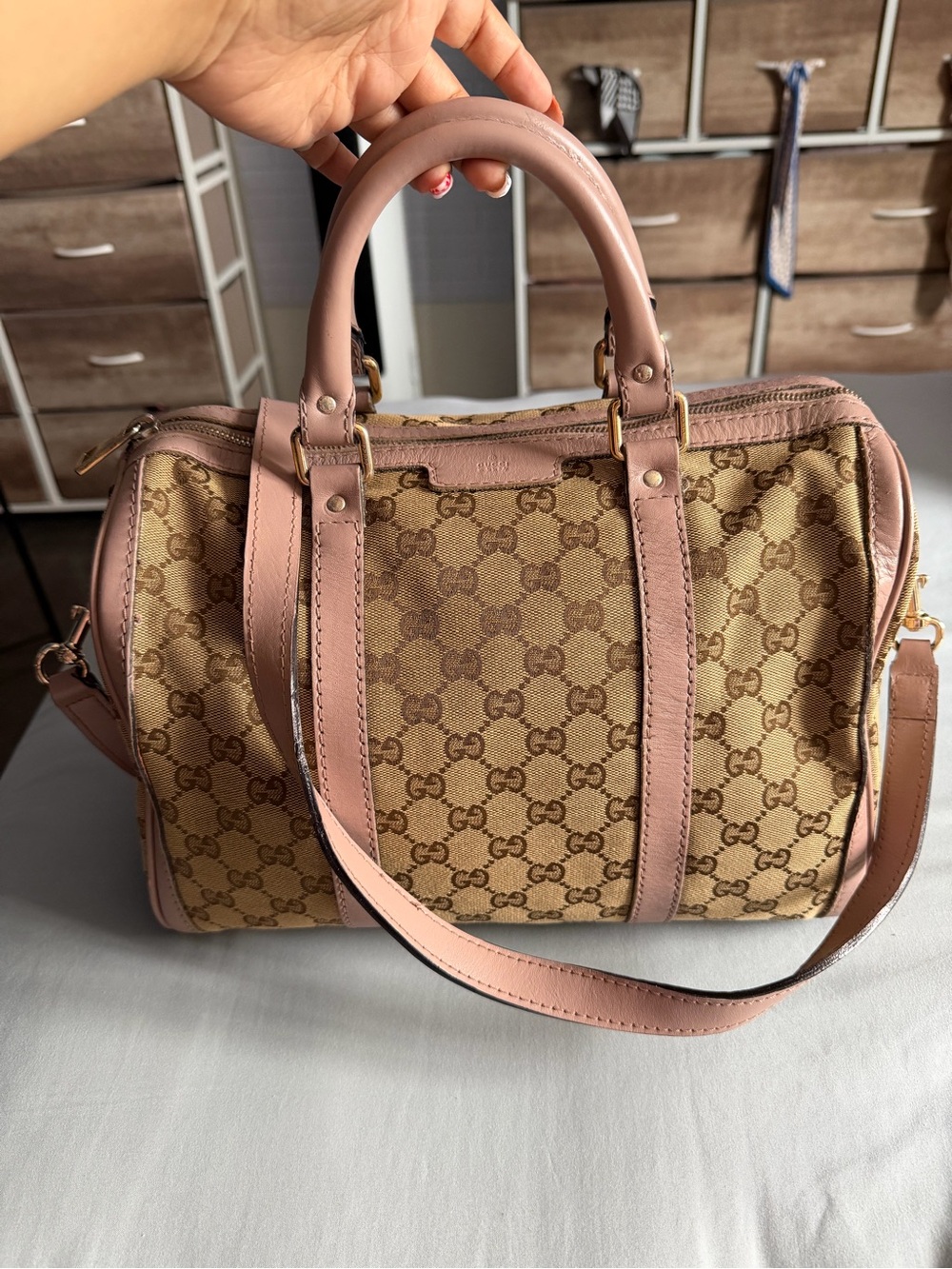 Gucci Beige/Pale Pink GG Canvas Joy Boston Bag with a shoulder strap.